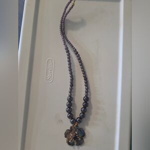 Elegant Purple Beaded Necklace with Floral Pendant